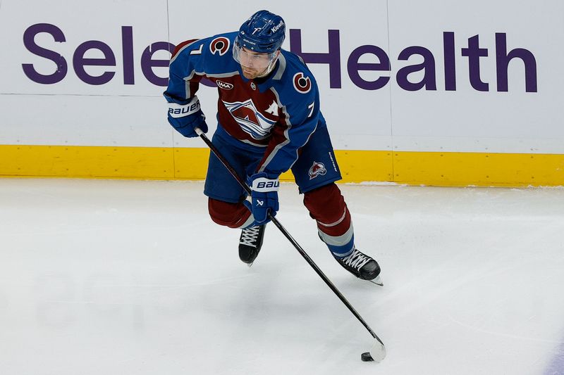 Feb 26, 2025; Denver, Colorado, USA; Colorado Avalanche defenseman Devon Toews (7) controls the puck in the first period against the New Jersey Devils at Ball Arena. Mandatory Credit: Isaiah J. Downing-Imagn Images