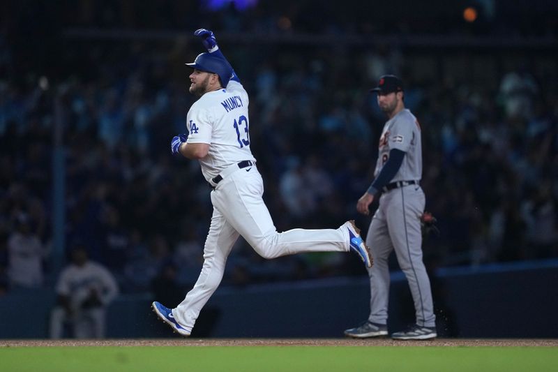 Sep 20, 2023; Los Angeles, California, USA; Los Angeles Dodgers third baseman Max Muncy (13) runs the bases after hitting a home run in the sixth inning against the Detroit Tigers at Dodger Stadium. Mandatory Credit: Kirby Lee-USA TODAY Sports