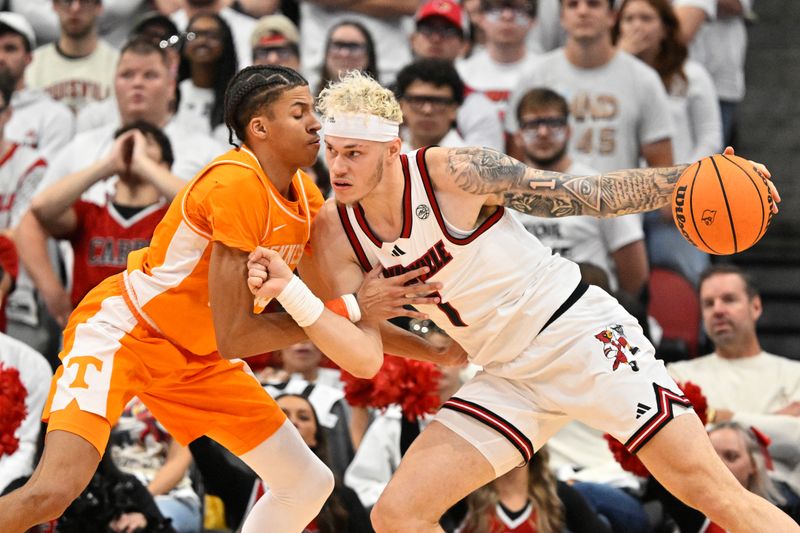 Nov 9, 2024; Louisville, Kentucky, USA;  Louisville Cardinals forward Kasean Pryor (7) controls the ball as Tennessee Volunteers guard Cameron Carr (43) defends during the first half at KFC Yum! Center. Tennessee defeated Louisville 77-55. Mandatory Credit: Jamie Rhodes-Imagn Images