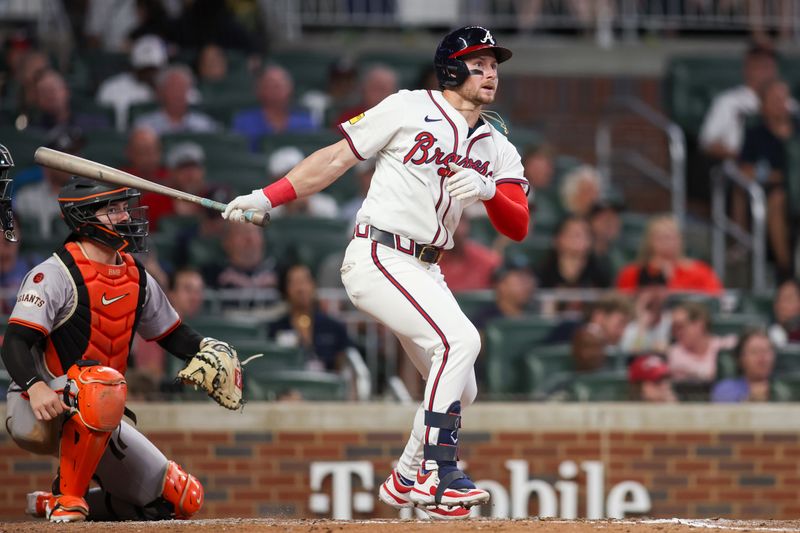 Jul 2, 2024; Atlanta, Georgia, USA; Atlanta Braves left fielder Jarred Kelenic (24) hits a double against the San Francisco Giants in the eighth inning at Truist Park. Mandatory Credit: Brett Davis-USA TODAY Sports