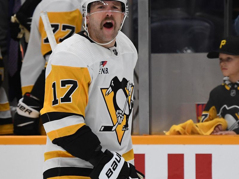 Nov 28, 2023; Nashville, Tennessee, USA; Pittsburgh Penguins right wing Bryan Rust (17) yells at the referees as they leave the ice following an overtime loss against the Nashville Predators at Bridgestone Arena. Mandatory Credit: Christopher Hanewinckel-USA TODAY Sports