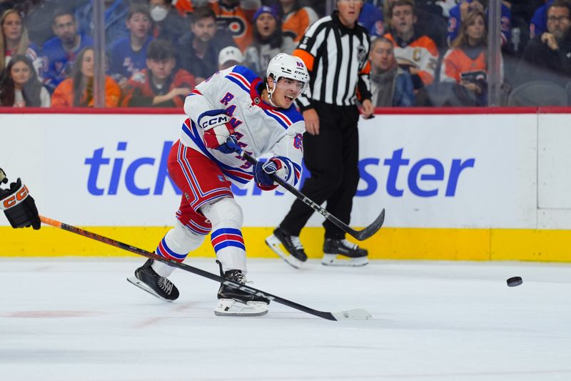 Nov 29, 2024; Philadelphia, Pennsylvania, USA; New York Rangers left wing Brett Berard (65) shoots the puck against the Philadelphia Flyers in the second period at Wells Fargo Center. Mandatory Credit: Kyle Ross-Imagn Images