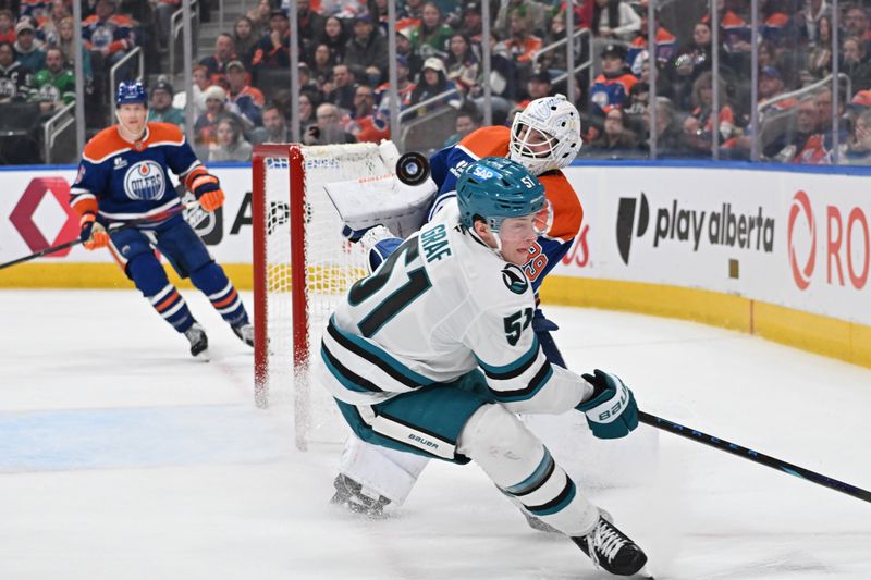 Mar 17, 2026; Edmonton, Alberta, CAN; Edmonton Oilers goalie Connor Ingram (39) stops the puck as San Jose Sharks right winger Collin Graf (51) skates past during the second period at Rogers Place. Mandatory Credit: Walter Tychnowicz-Imagn Images