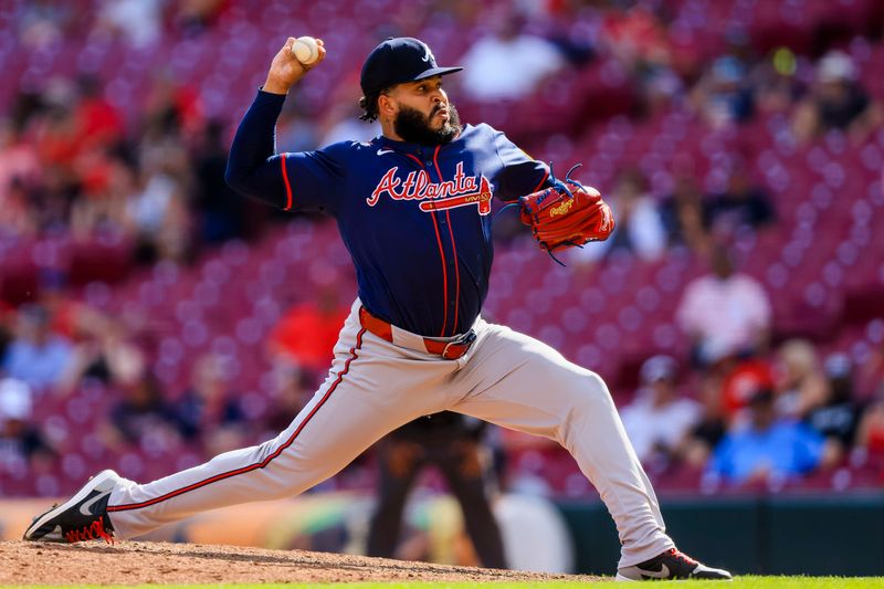 Sep 19, 2024; Cincinnati, Ohio, USA; Atlanta Braves relief pitcher Daysbel Hernandez (62) pitches against the Cincinnati Reds in the ninth inning at Great American Ball Park. Mandatory Credit: Katie Stratman-Imagn Images