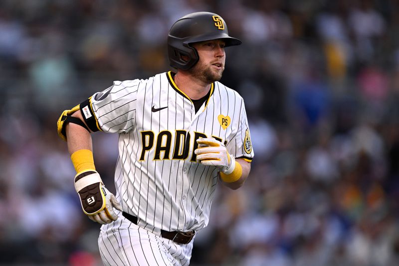 Apr 10, 2024; San Diego, California, USA; San Diego Padres first baseman Jake Cronenworth (9) rounds the bases after hitting a home run against the Chicago Cubs during the fifth inning at Petco Park. Mandatory Credit: Orlando Ramirez-USA TODAY Sports