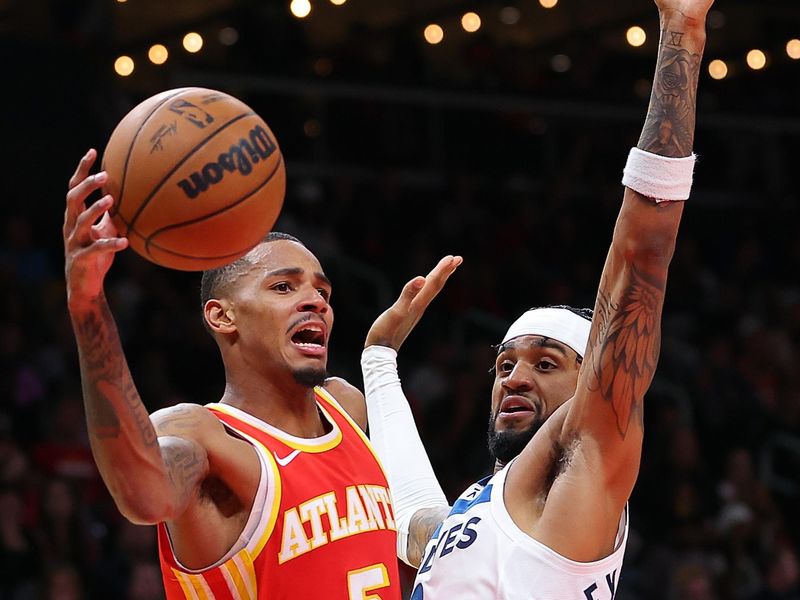 ATLANTA, GEORGIA - OCTOBER 30:  Dejounte Murray #5 of the Atlanta Hawks drives against Nickeil Alexander-Walker #9 of the Minnesota Timberwolves during the third quarter at State Farm Arena on October 30, 2023 in Atlanta, Georgia.  NOTE TO USER: User expressly acknowledges and agrees that, by downloading and/or using this photograph, user is consenting to the terms and conditions of the Getty Images License Agreement.  (Photo by Kevin C. Cox/Getty Images)