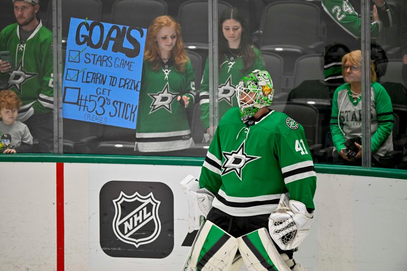 Apr 11, 2024; Dallas, Texas, USA; A Dallas Stars fan holds up a sign as Dallas Stars goaltender Scott Wedgewood (41) skate in warms up prior to a game against against the Winnipeg Jets at the American Airlines Center. Mandatory Credit: Jerome Miron-USA TODAY Sports