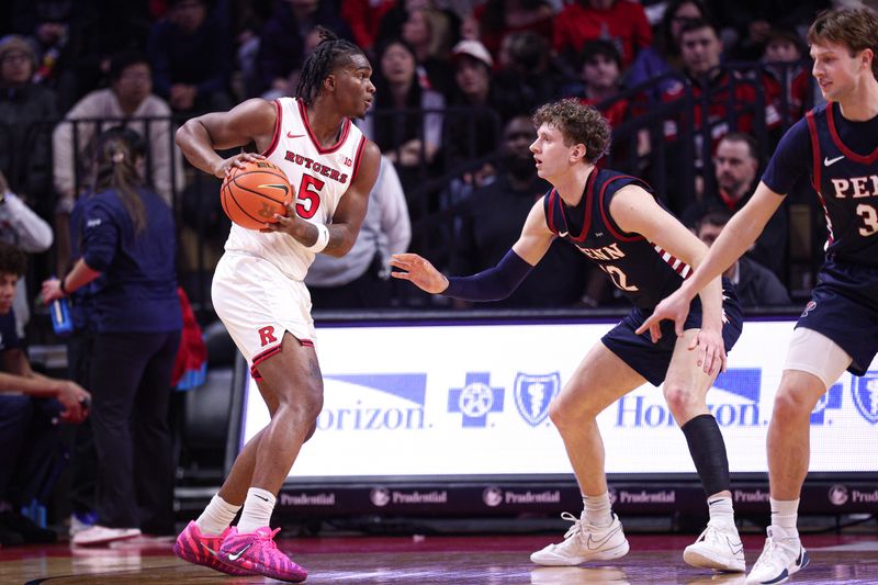 Dec 20, 2025; Piscataway, New Jersey, USA; Rutgers Scarlet Knights guard Darren Buchanan Jr. (5) looks to pass during the first half as Penn Quakers forward TJ Power (12) defends at Jersey Mike's Arena. Mandatory Credit: Vincent Carchietta-Imagn Images