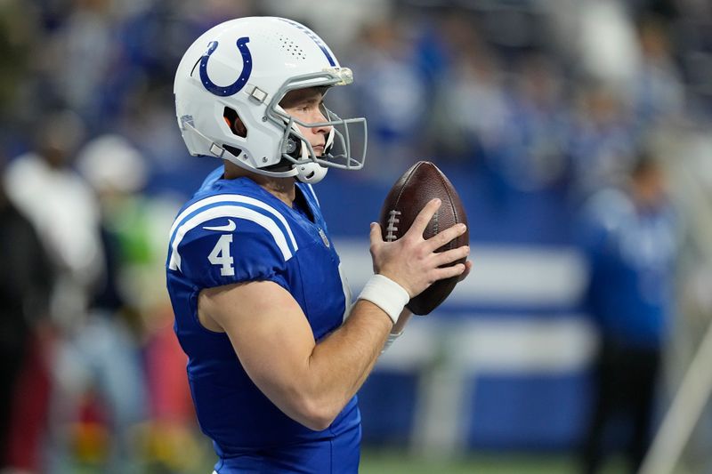 Indianapolis Colts quarterback Sam Ehlinger (4) warms up before an NFL football game against the Houston Texans, Saturday, Jan. 6, 2024, in Indianapolis. (AP Photo/Darron Cummings)