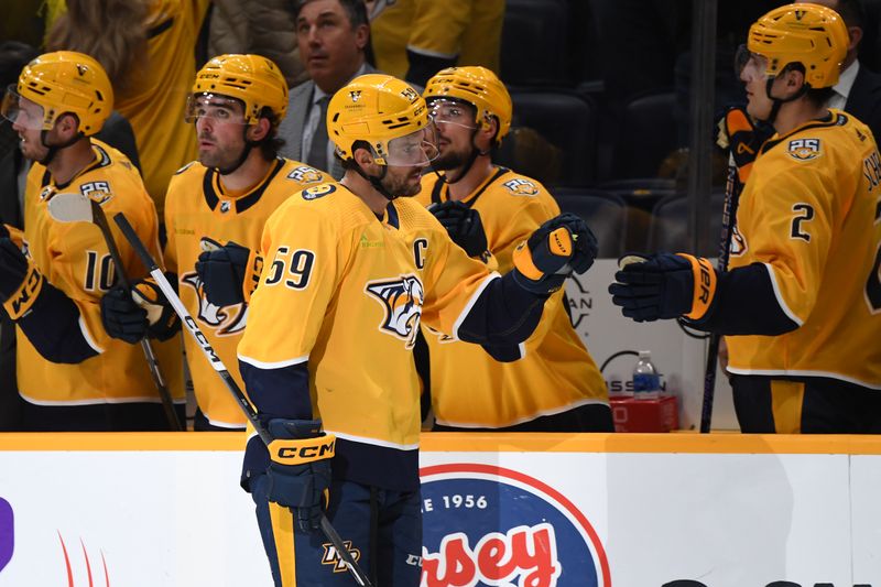 Feb 27, 2024; Nashville, Tennessee, USA; Nashville Predators defenseman Roman Josi (59) is congratulated by teammates after a goal during the second period against the Ottawa Senators at Bridgestone Arena. Mandatory Credit: Christopher Hanewinckel-USA TODAY Sports