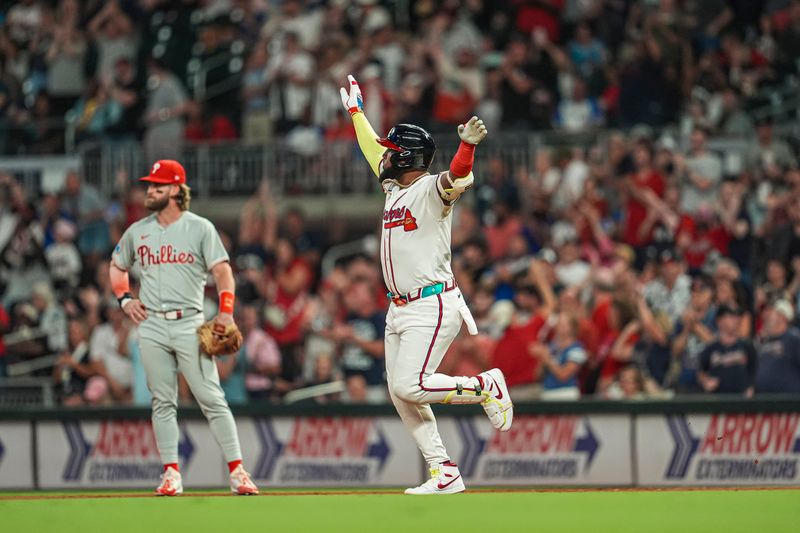 Aug 20, 2024; Cumberland, Georgia, USA; Atlanta Braves designated hitter Marcell Ozuna (20) reacts after hitting a home run against the Philadelphia Phillies during the sixth inning at Truist Park. Mandatory Credit: Dale Zanine-USA TODAY Sports