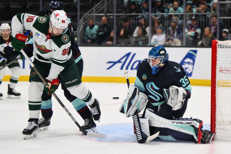 Dec 10, 2023; Seattle, Washington, USA; Seattle Kraken goaltender Joey Daccord (35) blocks a goal shot against the Minnesota Wild during the third period at Climate Pledge Arena. Mandatory Credit: Steven Bisig-USA TODAY Sports