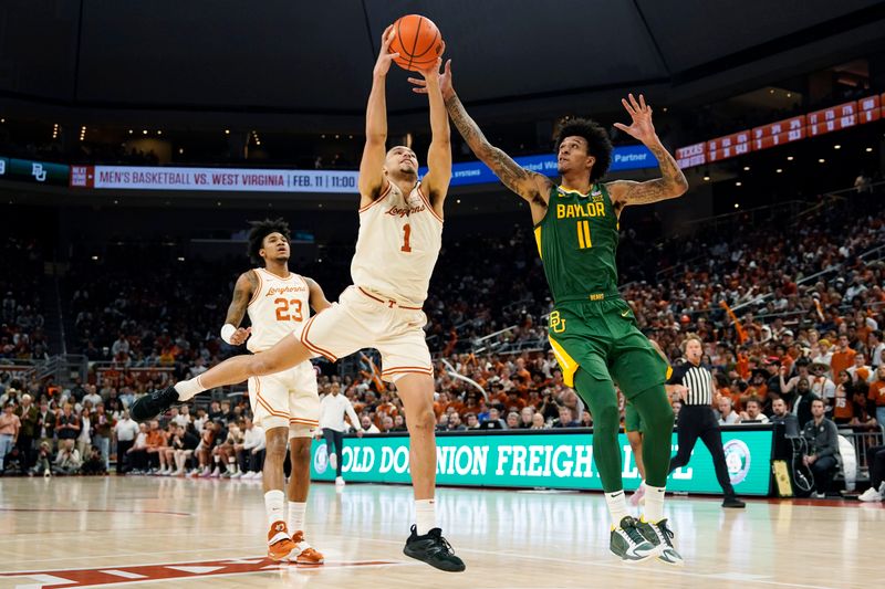 Jan 30, 2023; Austin, Texas, USA; Texas Longhorns forward Dylan Disu (1) and Baylor Bears forward Jalen Bridges (11) reach for a rebound during the second half at Moody Center. Mandatory Credit: Scott Wachter-USA TODAY Sports