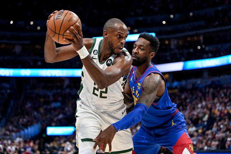 DENVER, CO - MARCH 25:  Khris Middleton #22 of the Milwaukee Bucks is defended by Jeff Green #32 of the Denver Nuggets in the secxond half of a game at Ball Arena on March 25, 2023 in Denver, Colorado. NOTE TO USER: User expressly acknowledges and agrees that, by downloading and or using this photograph, User is consenting to the terms and conditions of the Getty Images License Agreement. (Photo by Dustin Bradford/Getty Images)