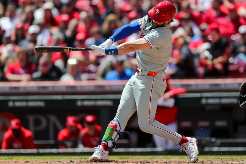 Apr 25, 2024; Cincinnati, Ohio, USA; Philadelphia Phillies first baseman Bryce Harper (3) hits a two-run home run in the third inning against the Cincinnati Reds at Great American Ball Park. Mandatory Credit: Katie Stratman-USA TODAY Sports