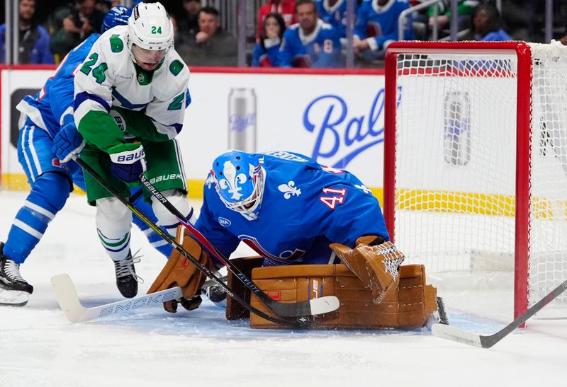 Oct 23, 2025; Denver, Colorado, USA; Carolina Hurricanes center Seth Jarvis (24) attempts to score on Colorado Avalanche goaltender Scott Wedgewood (41) in the first period at Ball Arena. Mandatory Credit: Ron Chenoy-Imagn Images