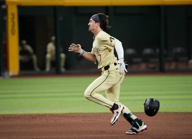 Aug 13, 2024; Phoenix, Arizona, USA; Arizona Diamondbacks outfielder Corbin Carroll (7) runs to third base en route to a triple against the Colorado Rockies during the ninth inning at Chase Field. Mandatory Credit: Joe Camporeale-USA TODAY Sports