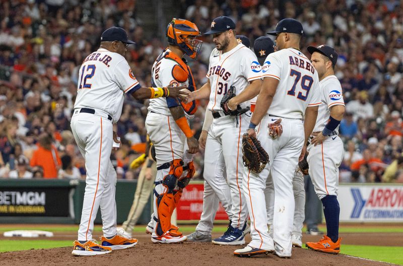 Sep 9, 2023; Houston, Texas, USA; Houston Astros manager Dusty Baker Jr. (12) takes relief pitcher Kendall Graveman (31) out of the game against the San Diego Padres in the sixth inning at Minute Maid Park. Mandatory Credit: Thomas Shea-USA TODAY Sports