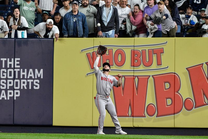 Jun 8, 2025; Bronx, New York, USA; Boston Red Sox outfielder Wilyer Abreu (52) catches a fly ball hit by New York Yankees first baseman Ben Rice (not pictured) during the ninth inning at Yankee Stadium. Mandatory Credit: John Jones-Imagn Images