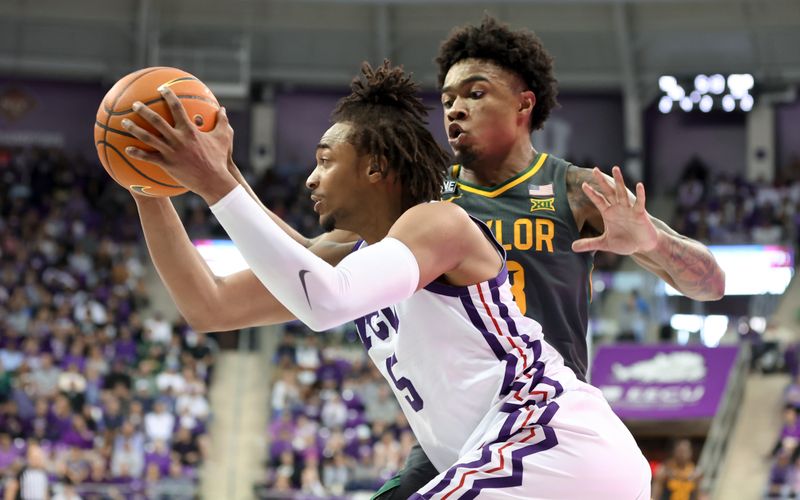 Feb 11, 2023; Fort Worth, Texas, USA;  TCU Horned Frogs forward Chuck O'Bannon Jr. (5) drives to the basket as Baylor Bears guard Langston Love (13) defends during the second half at Ed and Rae Schollmaier Arena. Mandatory Credit: Kevin Jairaj-USA TODAY Sports