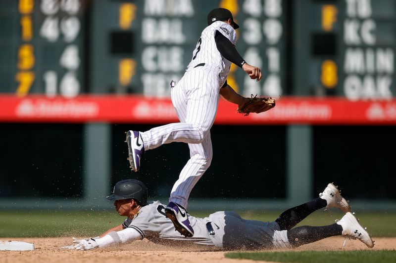 Jul 16, 2023; Denver, Colorado, USA; New York Yankees right fielder Oswaldo Cabrera (95) safely steals second against Colorado Rockies second baseman Alan Trejo (13) in the eleventh inning at Coors Field. Mandatory Credit: Isaiah J. Downing-USA TODAY Sports