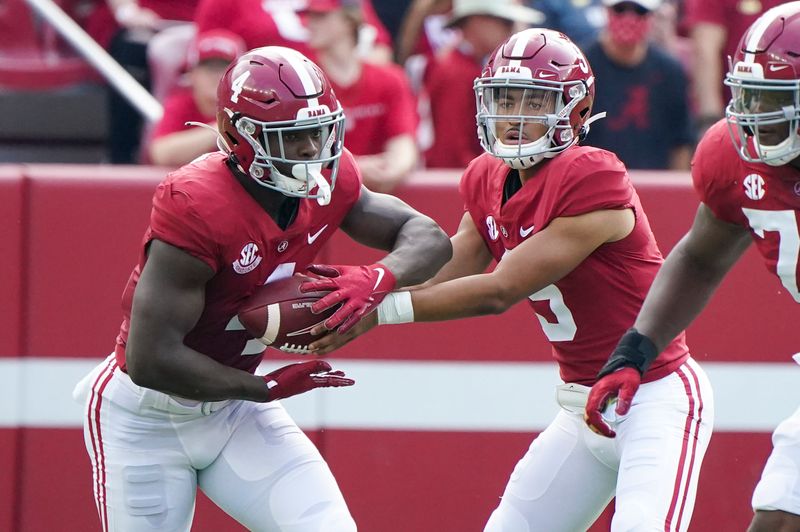 Sep 11, 2021; Tuscaloosa, Alabama, USA;  Alabama Crimson Tide quarterback Bryce Young (9) hands the ball off too Alabama Crimson Tide running back Brian Robinson Jr. (4)  at Bryant-Denny Stadium. Mandatory Credit: Marvin Gentry-USA TODAY Sports