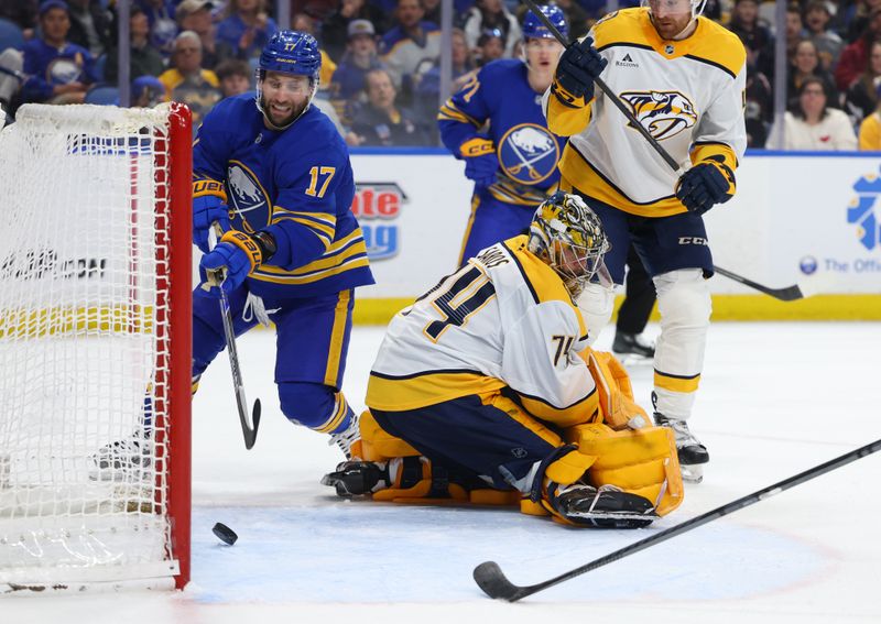 Mar 7, 2026; Buffalo, New York, USA;  Buffalo Sabres left wing Jason Zucker (17) scores a goal on Nashville Predators goaltender Juuse Saros (74) during the second period at KeyBank Center. Mandatory Credit: Timothy T. Ludwig-Imagn Images