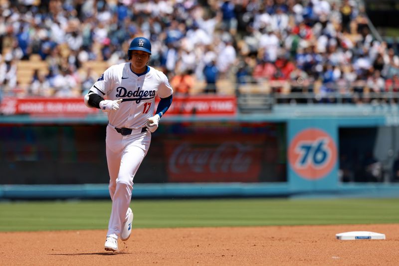 May 5, 2024; Los Angeles, California, USA;  Los Angeles Dodgers designated hitter Shohei Ohtani (17) runs around bases after hitting a home run during the first inning against the Atlanta Braves at Dodger Stadium. Mandatory Credit: Kiyoshi Mio-USA TODAY Sports
