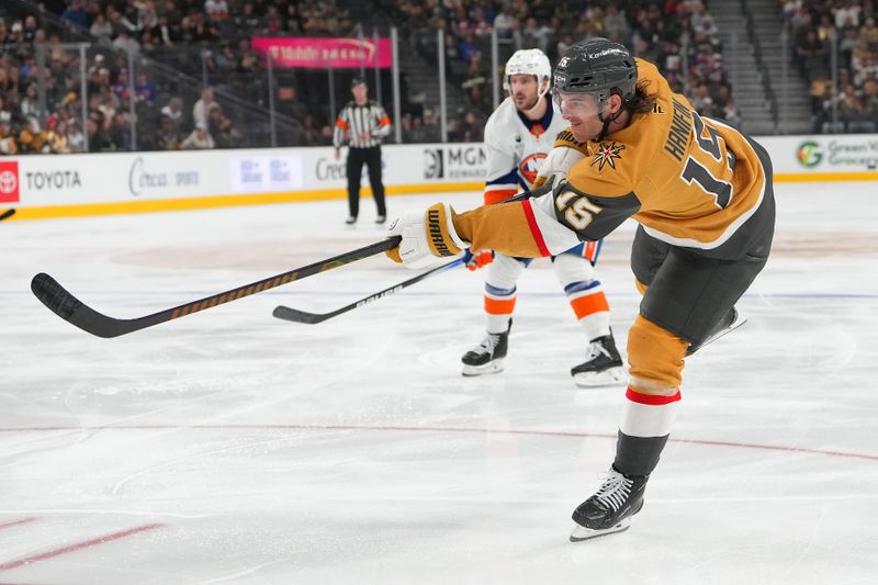 Nov 13, 2025; Las Vegas, Nevada, USA; Vegas Golden Knights defenseman Noah Hanifin (15) shoots against the New York Islanders during the third period at T-Mobile Arena. Mandatory Credit: Stephen R. Sylvanie-Imagn Images