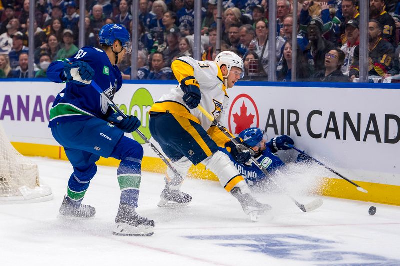 Apr 21, 2024; Vancouver, British Columbia, CAN; Vancouver Canucks forward Dakota Joshua (81) watches Nashville Predators defenseman Jeremy Lauzon (3) handle the puck in the first period in game one of the first round of the 2024 Stanley Cup Playoffs at Rogers Arena. Mandatory Credit: Bob Frid-USA TODAY Sports