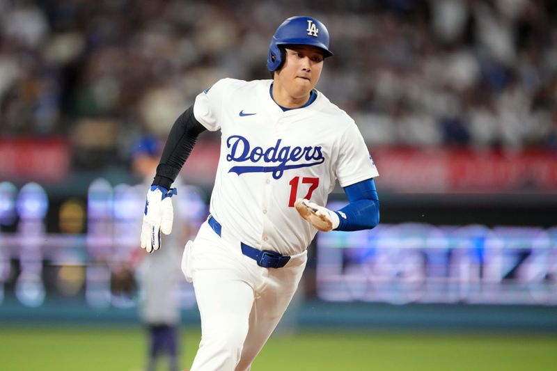 Aug 8, 2025; Los Angeles, California, USA; Los Angeles Dodgers designated hitter Shohei Ohtani (17) scores in the fifth inning against the Toronto Blue Jays at Dodger Stadium. Mandatory Credit: Kirby Lee-Imagn Images