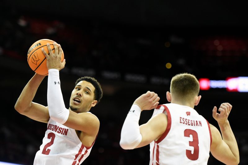 Jan 3, 2023; Madison, Wisconsin, USA; Wisconsin Badgers guard Jordan Davis (2) rebounds the ball alongside teammate Connor Essegian (3) against the Minnesota Golden Gophers during the first half at the Kohl Center. Mandatory Credit: Kayla Wolf-USA TODAY Sports