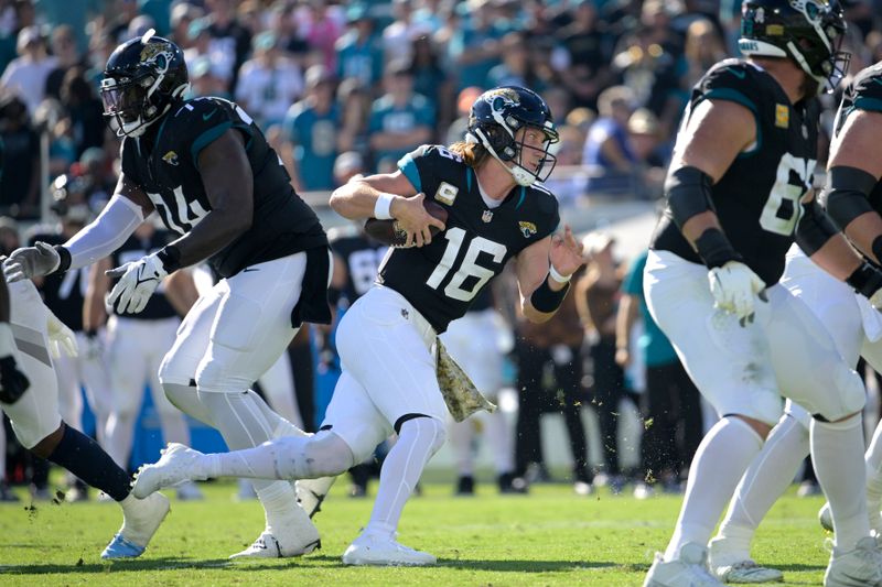 Jacksonville Jaguars quarterback Trevor Lawrence (16) scrambles for yardage during the first half of an NFL football game against the Tennessee Titans, Sunday, Nov. 19, 2023, in Jacksonville, Fla. (AP Photo/Phelan M. Ebenhack)