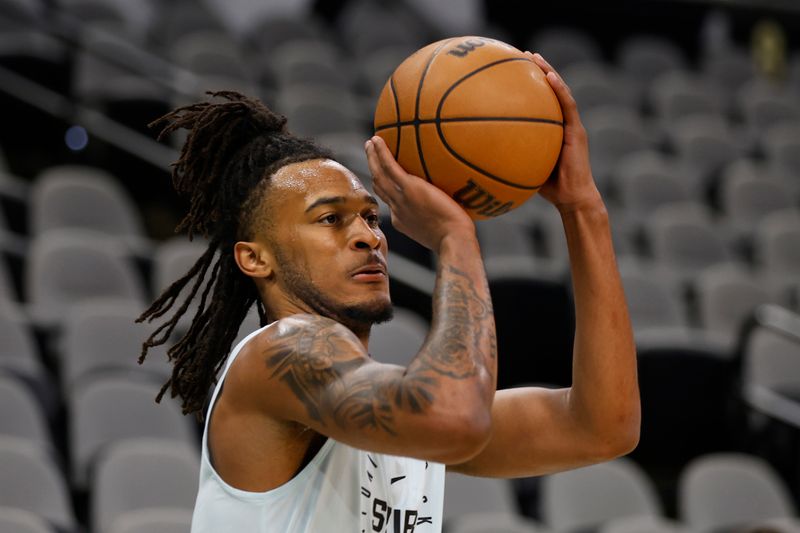 SAN ANTONIO, TX - FEBRUARY 01: Stephon Castle #5 of the San Antonio Spurs takes warm up shots before the game against the Miami Heat at Frost Bank Center on February 1, 2025 in San Antonio, Texas. NOTE TO USER: User expressly acknowledges and agrees that, by downloading and or using this photograph, User is consenting to terms and conditions of the Getty Images License Agreement. (Photo by Ronald Cortes/Getty Images)