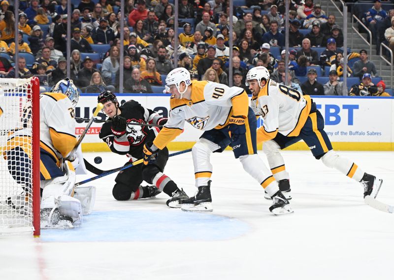 Jan 31, 2025; Buffalo, New York, USA; Buffalo Sabres right wing Jack Quinn (22) takes a shot on goal as Nashville Predators goaltender Justus Annunen (29) blocks it in the second period at the KeyBank Center. Mandatory Credit: Mark Konezny-Imagn Images