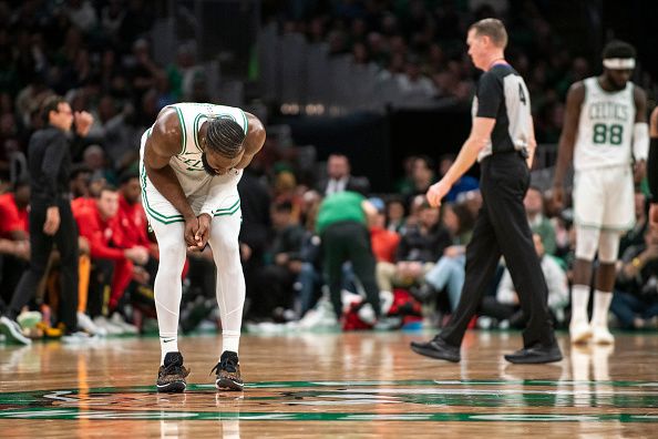 Boston, MA - November 26: Boston Celtics SG Jaylen Brown bends over in pain during the third quarter. The Celtics beat the Atlanta Hawks, 113-103. (Photo by Tanner Pearson/The Boston Globe via Getty Images)