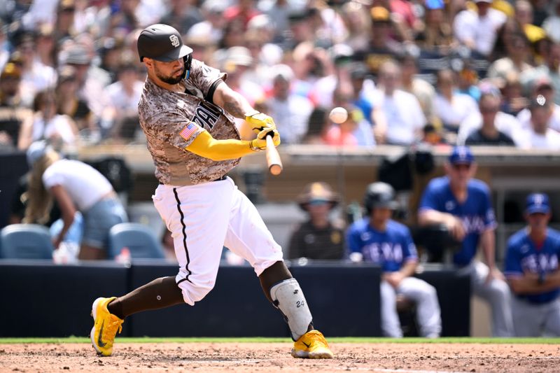 Jul 30, 2023; San Diego, California, USA; San Diego Padres catcher Gary Sanchez (99) hits a home run against the Texas Rangers during the fifth inning at Petco Park. Mandatory Credit: Orlando Ramirez-USA TODAY Sports