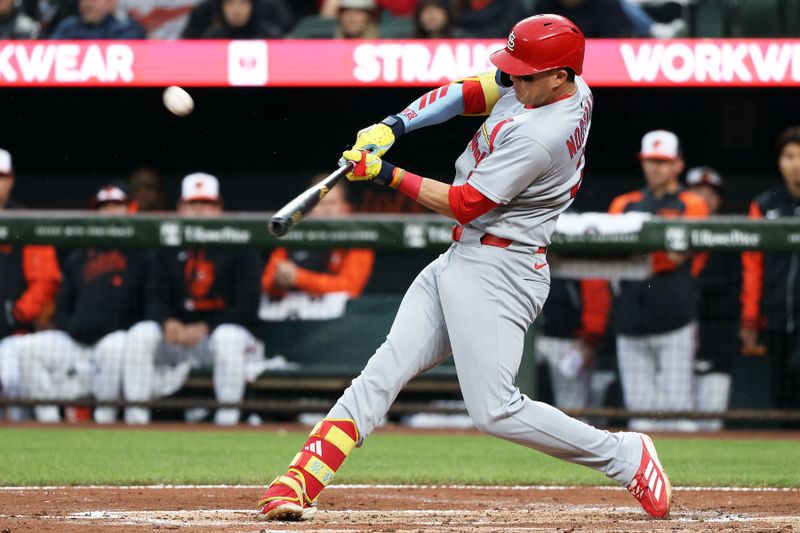 May 27, 2025; Baltimore, Maryland, USA; St. Louis Cardinals outfielder Lars Nootbaar (21) hits a home run during the second inning against the Baltimore Orioles at Oriole Park at Camden Yards. Mandatory Credit: Daniel Kucin Jr.-Imagn Images
