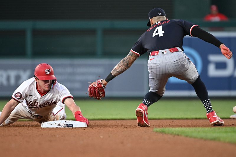 May 20, 2024; Washington, District of Columbia, USA; Washington Nationals outfielder Jacob Young (30) slides into second base before shortstop Carlos Correa (4) can apply the tag during the fifth inning  at Nationals Park. Mandatory Credit: Rafael Suanes-USA TODAY Sports