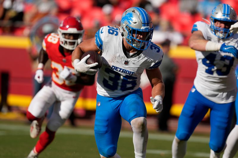 Detroit Lions running back Jake Funk (36) runs against the Kansas City Chiefs during the second half of an NFL preseason football game Saturday, Aug. 17, 2024, in Kansas City, Mo. (AP Photo/Ed Zurga)