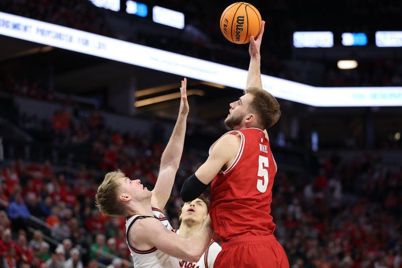 Mar 17, 2024; Minneapolis, MN, USA; Illinois Fighting Illini guard AJ Redd (5) plays the ball defend by Illinois Fighting Illini forward Marcus Domask (3) in the first half at Target Center. Mandatory Credit: Matt Krohn-USA TODAY Sports