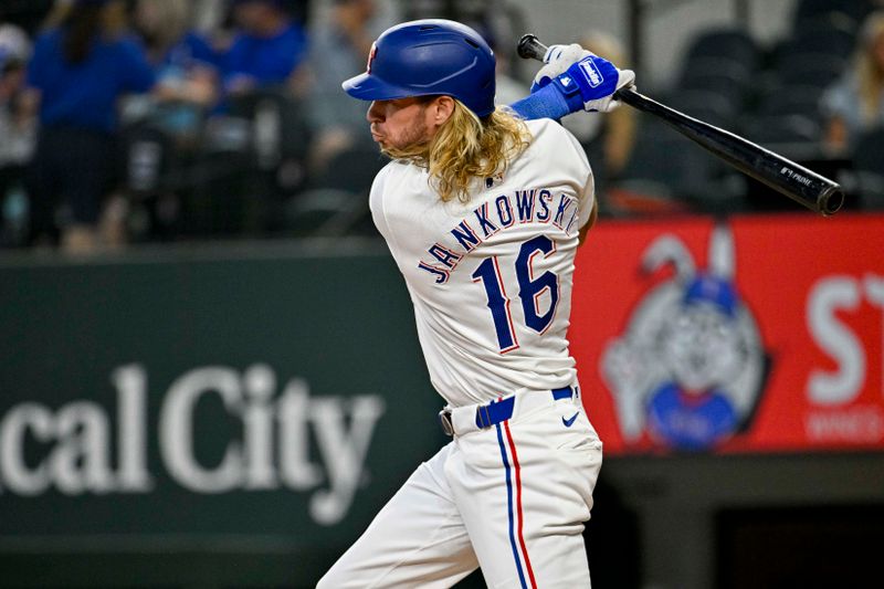 Jun 8, 2024; Arlington, Texas, USA; Texas Rangers left fielder Travis Jankowski (16) hits a single against the San Francisco Giants during the second inning at Globe Life Field. Mandatory Credit: Jerome Miron-USA TODAY Sports