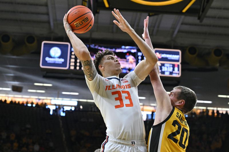 Mar 10, 2024; Iowa City, Iowa, USA; Illinois Fighting Illini forward Coleman Hawkins (33) shoots the ball over Iowa Hawkeyes forward Payton Sandfort (20) during the first half at Carver-Hawkeye Arena. Mandatory Credit: Jeffrey Becker-USA TODAY Sports