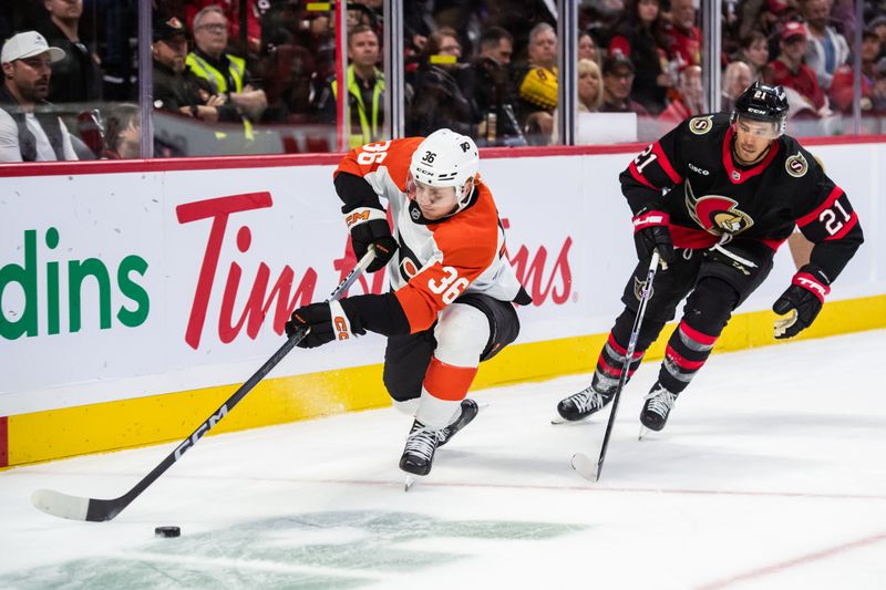 Oct 14, 2023; Ottawa, Ontario, CAN; Philadelphia Flyers defenseman Emil Andrae (36) moves the puck with Ottawa Senators right wing Mathieu Joseph (21) in pursuit during the first period at the Canadian Tire Centre. Mandatory Credit: Marc DesRosiers-USA TODAY Sports