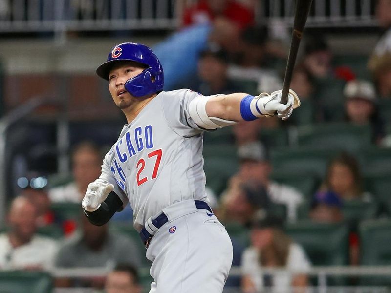 Sep 28, 2023; Atlanta, Georgia, USA; Chicago Cubs right fielder Seiya Suzuki (27) hits a RBI double against the Atlanta Braves in the sixth inning at Truist Park. Mandatory Credit: Brett Davis-USA TODAY Sports