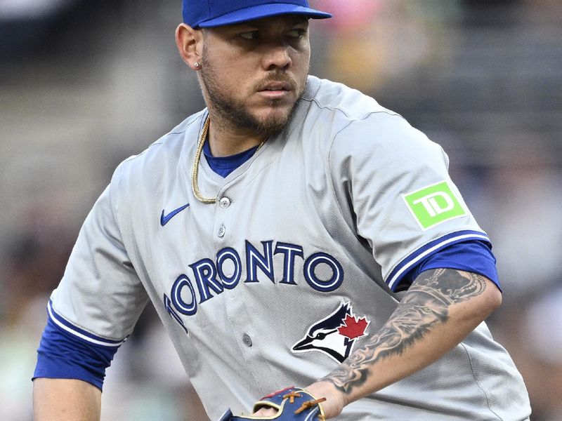 Apr 19, 2024; San Diego, California, USA; Toronto Blue Jays starting pitcher Yariel Rodriguez (29) throws a pitch against the San Diego Padres during the first inning at Petco Park. Mandatory Credit: Orlando Ramirez-USA TODAY Sports 