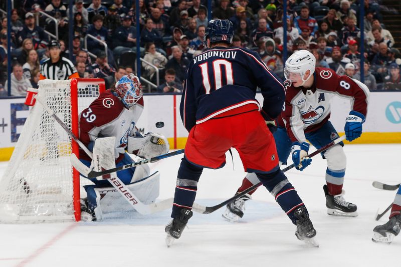 Apr 3, 2025; Columbus, Ohio, USA; Colorado Avalanche goalie MacKenzie Blackwood (39) makes a save as Columbus Blue Jackets left wing Dmitri Voronkov (10) looks for a rebound during the second period at Nationwide Arena. Mandatory Credit: Russell LaBounty-Imagn Images