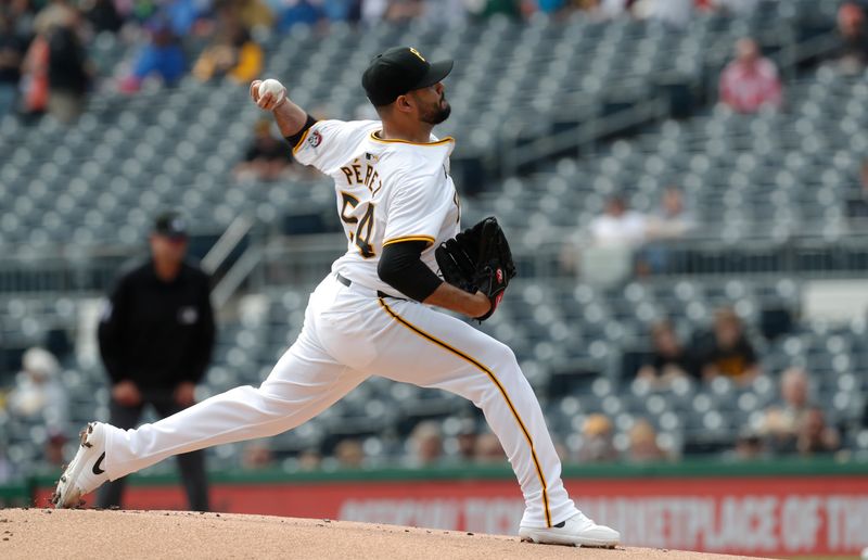 Apr 9, 2024; Pittsburgh, Pennsylvania, USA;  Pittsburgh Pirates starting pitcher Martin Perez (54) delivers against the Detroit Tigers during the first inning at PNC Park. Mandatory Credit: Charles LeClaire-USA TODAY Sports