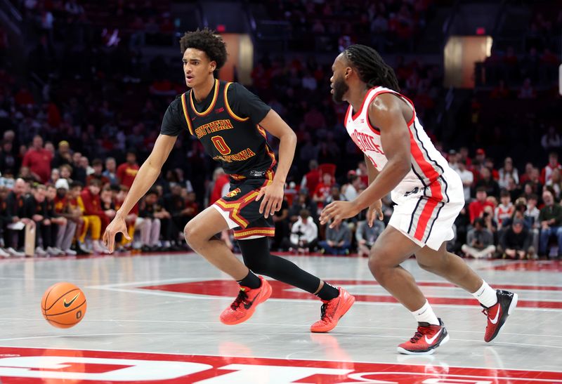 Feb 11, 2026; Columbus, Ohio, USA;  USC Trojans guard Alijah Arenas (0) dribbles the ball as Ohio State Buckeyes guard Bruce Thornton (2) defends during the first half at Value City Arena. Mandatory Credit: Joseph Maiorana-Imagn Images