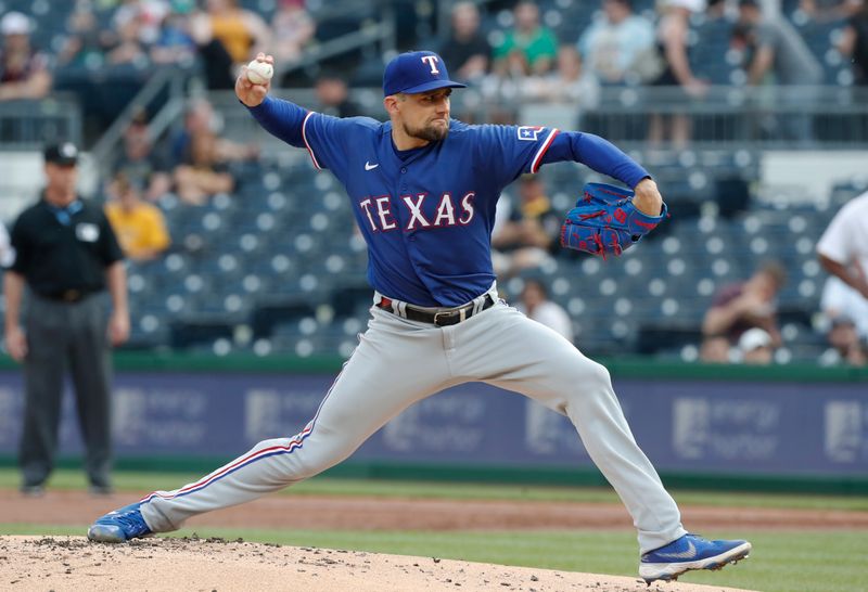 May 23, 2023; Pittsburgh, Pennsylvania, USA; Texas Rangers starting pitcher Nathan Eovaldi (17) delivers a pitch against the Pittsburgh Pirates during the first inning at PNC Park. Mandatory Credit: Charles LeClaire-USA TODAY Sports